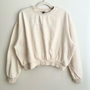 Divided Cream Cropped Sweatshirt